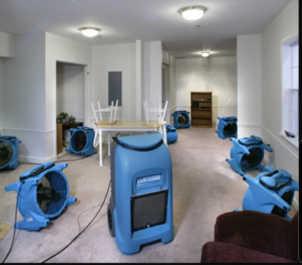 Air movers and dehumidifier setup for Water Damage Restoration in Winslow